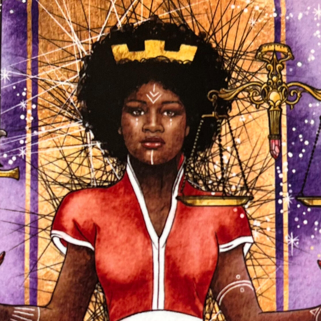 The Justice card from the Unfolding Path Tarot deck by Athene Noctua Art image of Black woman with an afro wearing a red and white dress and standing in front of a purple and gold back ground